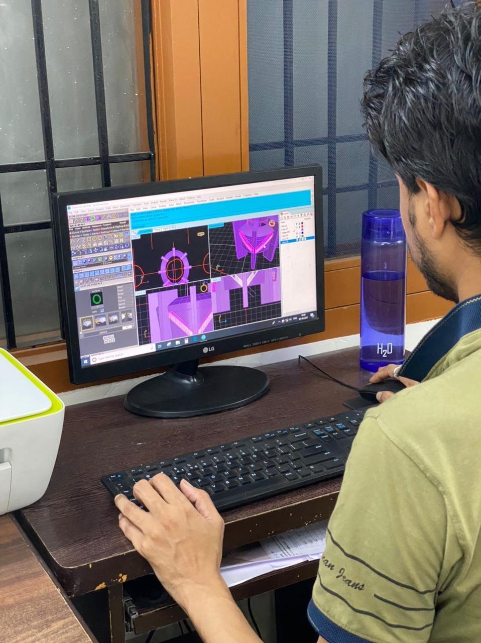 CAD designer modelling a jewellery piece on screen