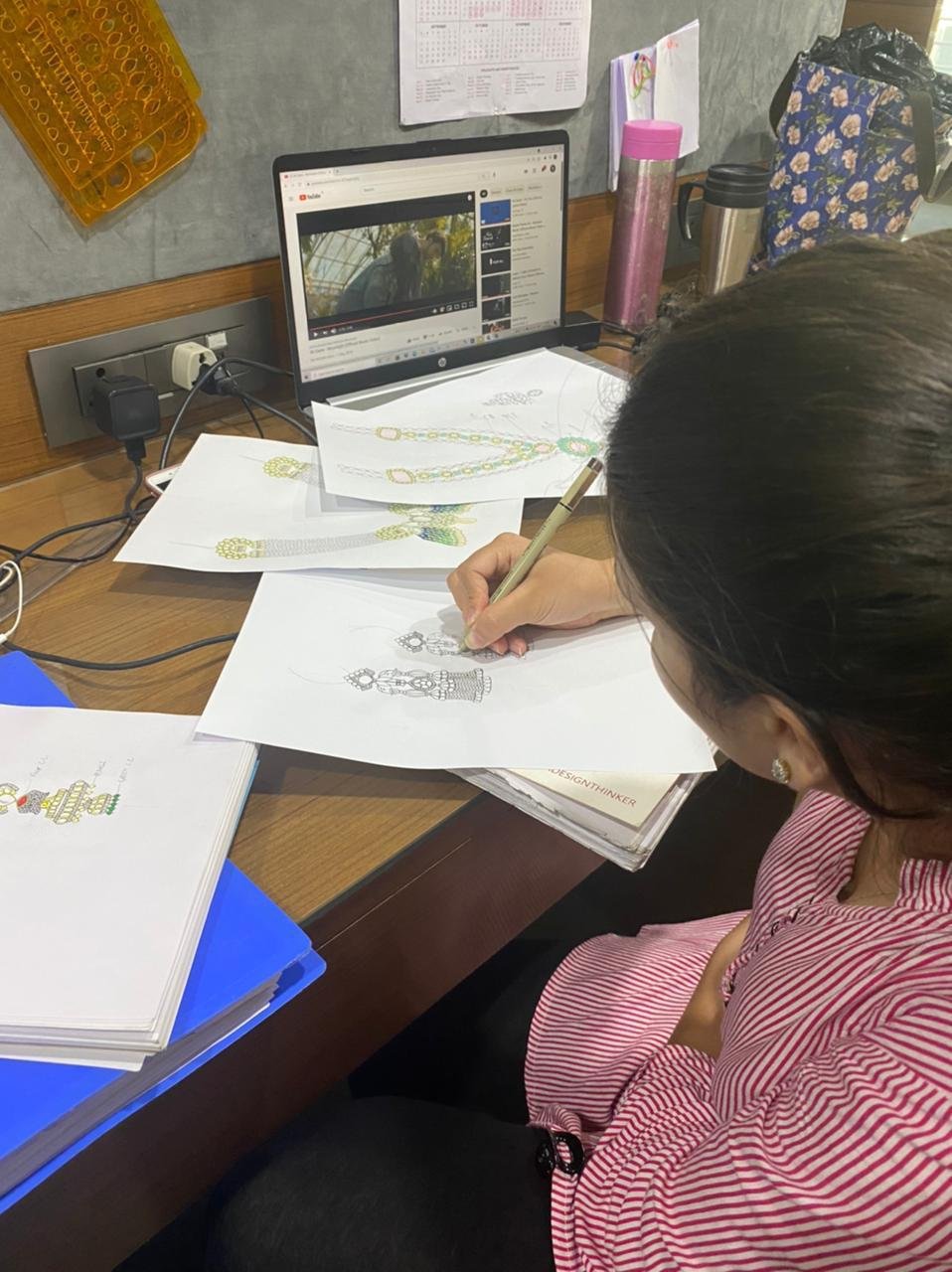 Designer hand-sketching a jewellery design