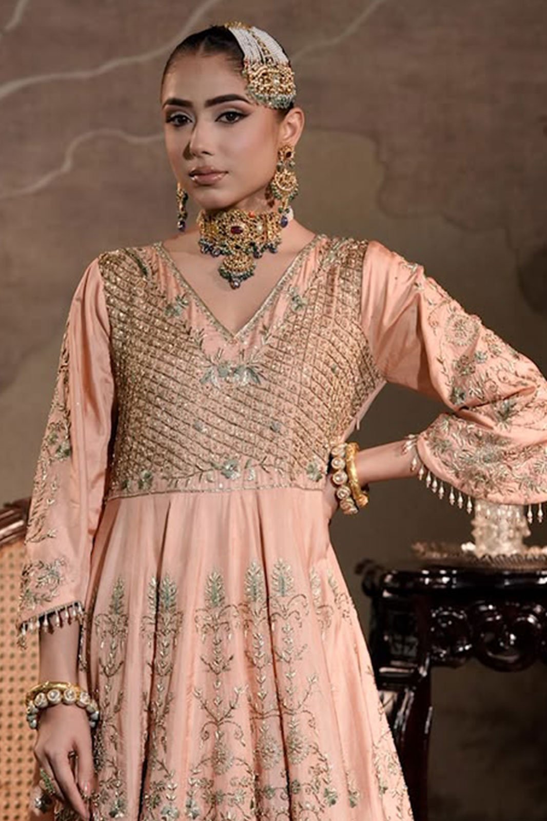 Blush anarkali with an emerald polki set
